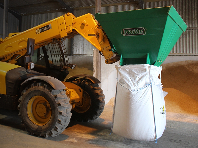 Small hopper to tip grain from a telehandler bucket into The Farming
